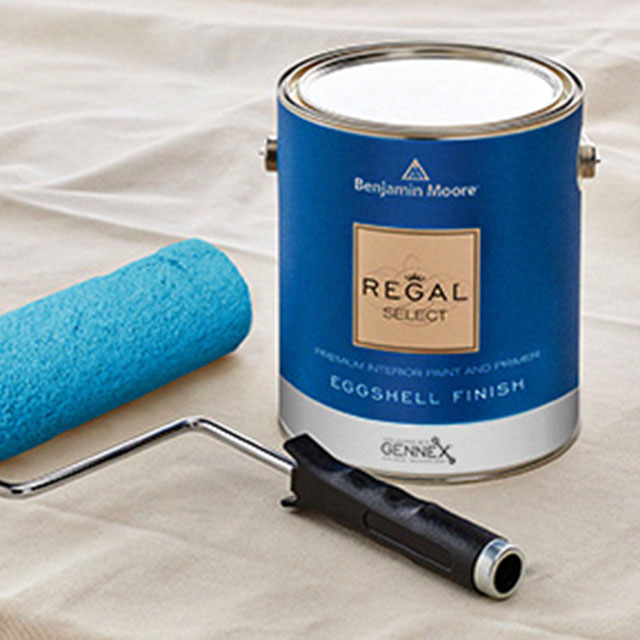 A can of Benjamin Moore Regal® Select paint in a newly painted room.