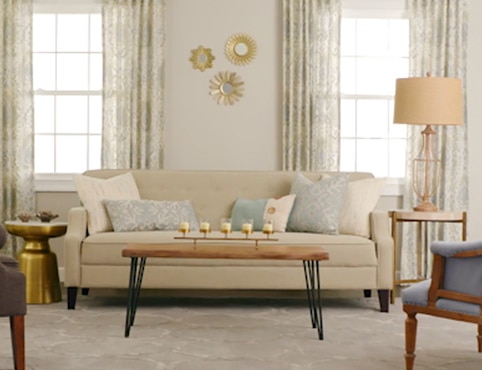 Well-lit living room with neutral decor.