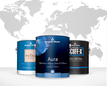 Cans of Benjamin Moore Paint are Presented Before a Gray Global Map