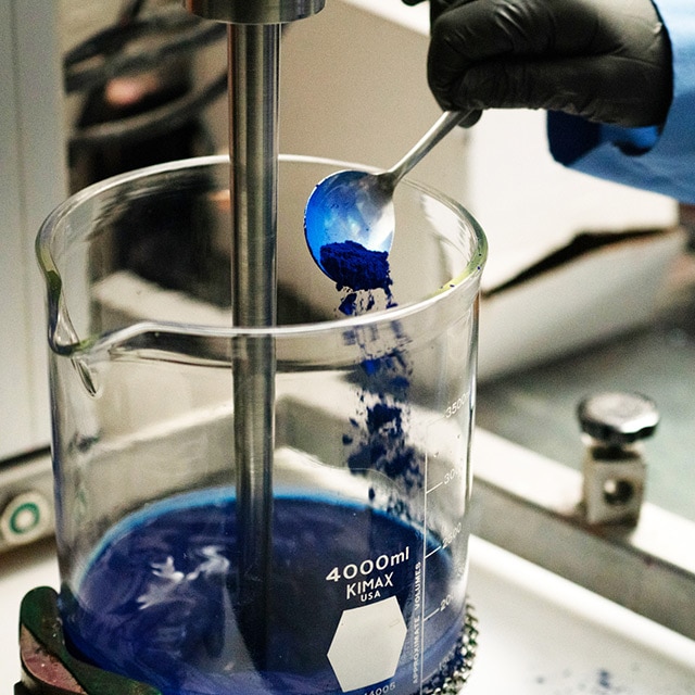 A chemist in the Benjamin Moore R&D lab works on the paint formulation for AURA Interior paint.