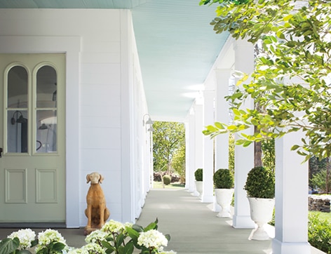 Open porch with columns and green landscape