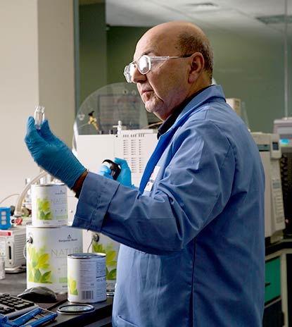 A senior scientist in Benjamin Moore’s R&D lab measures samples of Natura Interior paint. A senior scientist in Benjamin Moore’s R&D lab measures samples of Natura Interior paint.