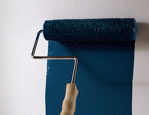 Dark blue paint rolled onto wall Dark blue paint rolled onto wall