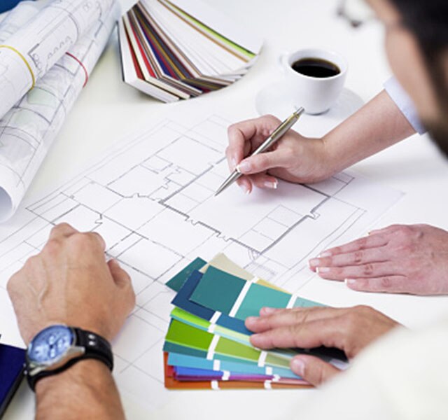 Architects drawing and collaborating during a meeting
