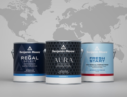 Cans of Benjamin Moore paint are presented in front of a global map.