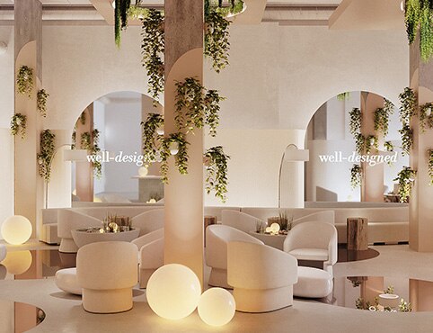 This beautiful, lounge-like Well-Designed space features walls painted in a gentle pink, Love & Happiness 1191, hanging plants, relaxing seating, soft glowing lamps, and accent floor mirrors. 