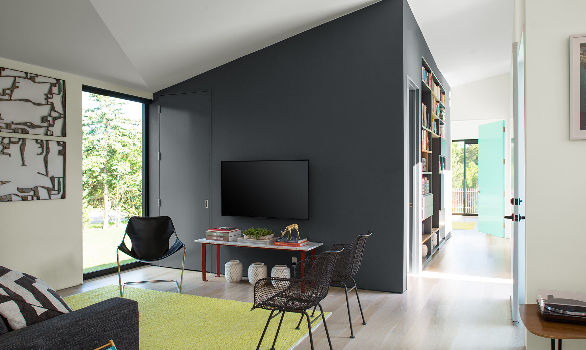 Contemporary living room with dark gray feature wall.