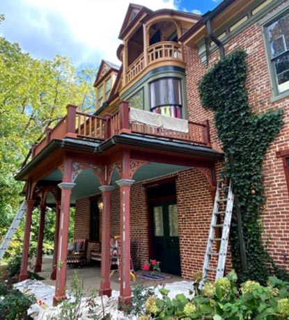 Progress photo of the exterior of a historic Gettysburg home that was repainted using precise color matching.