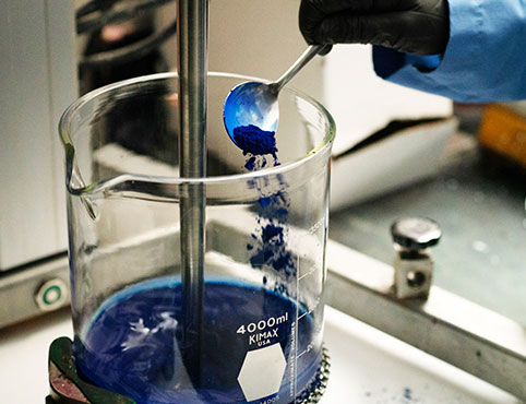 A chemist in the Benjamin Moore R&D lab works on the paint formulation for AURA Interior paint.