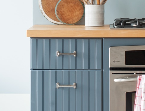 Repainted blue kitchen cabinets.