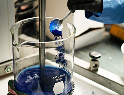 A chemist in the Benjamin Moore R&D lab works on the paint formulation for AURA Interior paint.