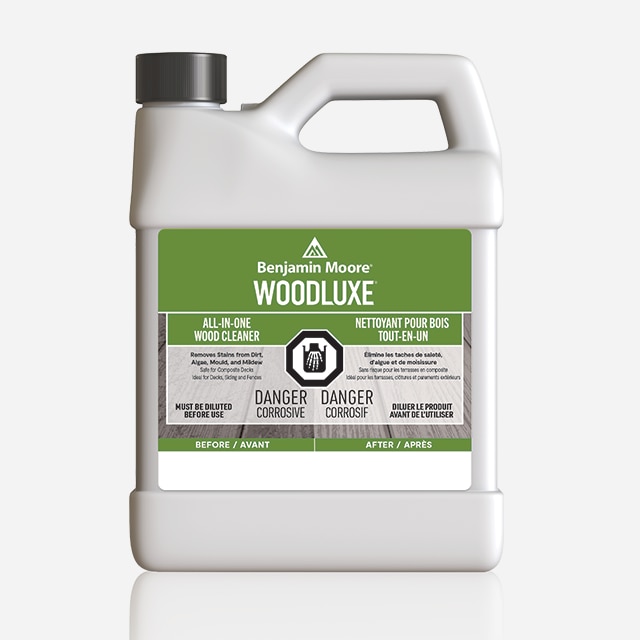 A 3.79 L plastic container of Woodluxe® All-In-One Wood Cleaner.