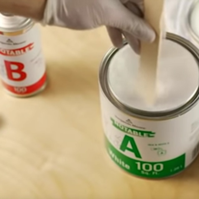 Mixing Notable Dry Erase paint with a wooden paint stirrer