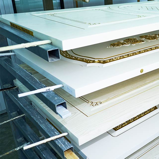 A door racking system loaded with freshly painted doors