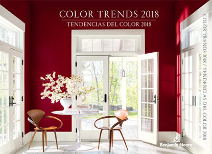 A rich red sitting room is flooded with light through several white French doors. A rich red sitting room is flooded with light through several white French doors.