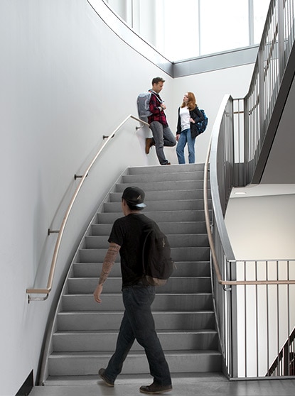 A bright white college stairwell drives home  the aesthetic allure of a  clean, scuff-free space.