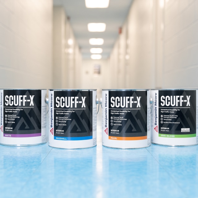 Four 3.79 L cans of Scuff-X Interior paint in matte, eggshell, satin and semi-gloss finishes.