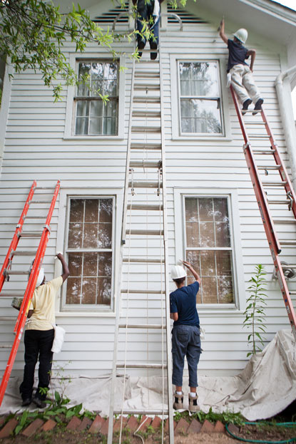 The HOPE (hands-on preservation experience) Crew restoring the exterior of a home