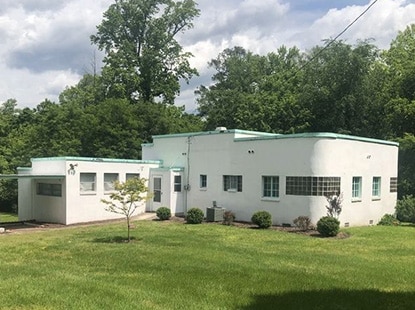 Azurest South, designed by Amaza Lee Meredith, features white-painted walls, mint trim, and glass-blocked windows. Azurest South, designed by Amaza Lee Meredith, features white-painted walls, mint trim, and glass-blocked windows.